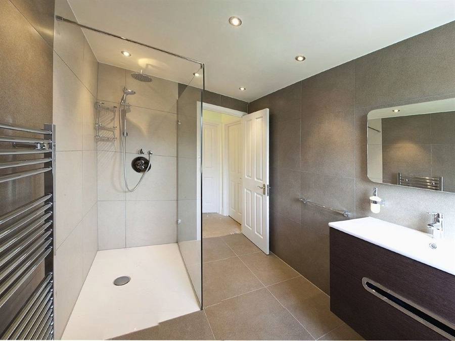 Small Loft Bathroom Interior With Brown Tile Wall