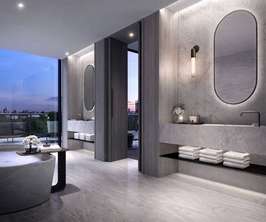 Dark vertical tiles combine with a solid benchtop in this bathroom