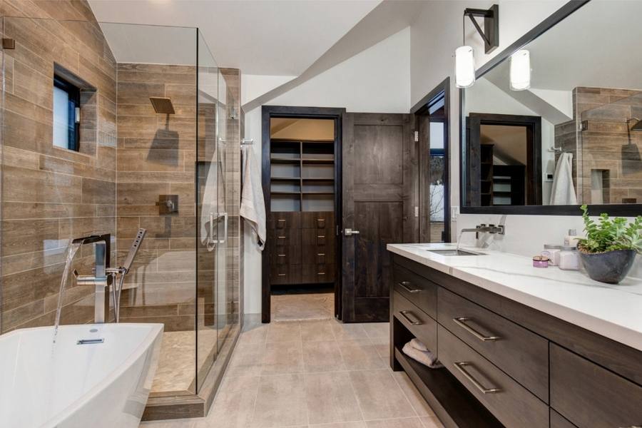 bathroom with dark cabinets