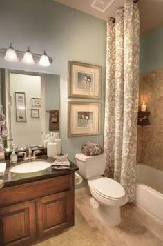 A gorgeous bathroom draped in natural hues and warm lighting