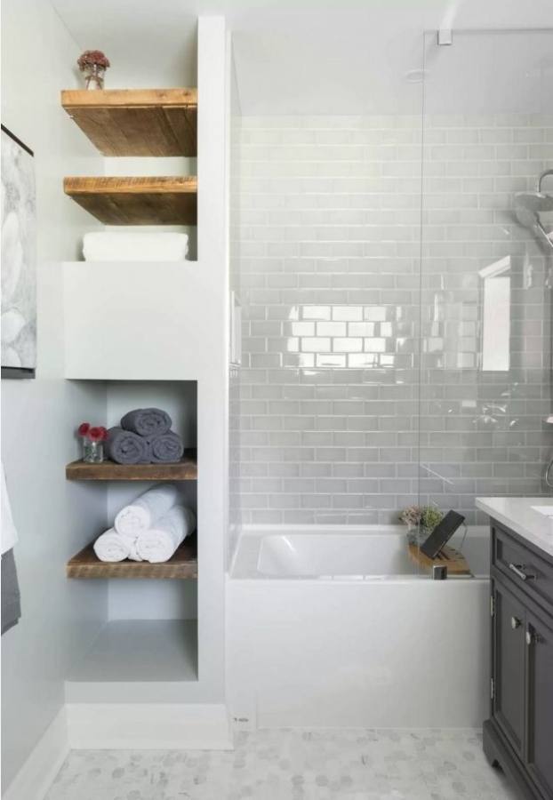 A gorgeous bathroom draped in natural hues and warm lighting