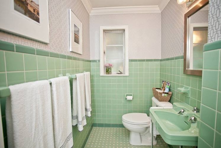 various green subway tile bathroom