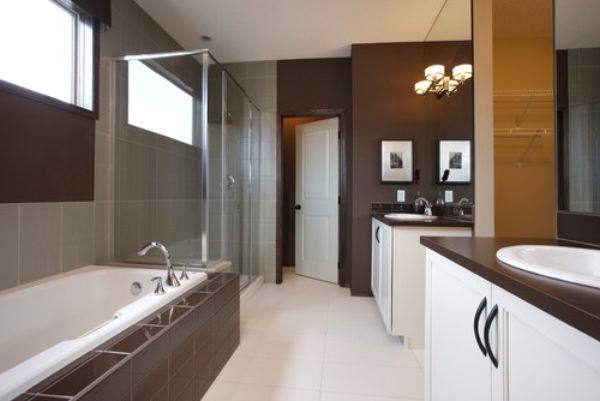 Another bathroom featuring a soaking tub with a curtain and a stylish tiles wall