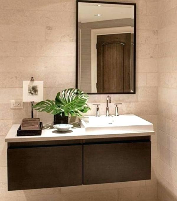 Farmhouse bathroom design with dark cabinets