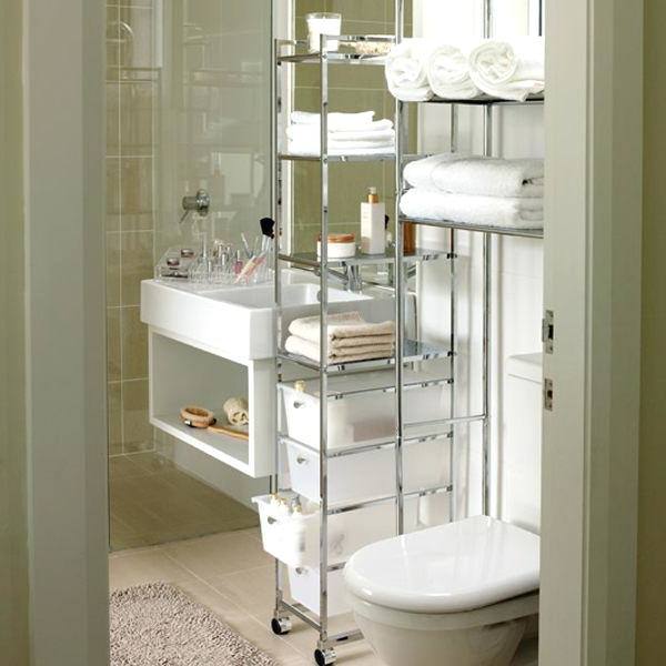 Bright, light family bathroom with bathroom ladder storage unit, towels and bathroom accessories