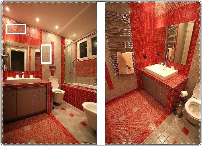 In this tiny bathroom, red pops against the dark floor, white fixtures and gray painted walls