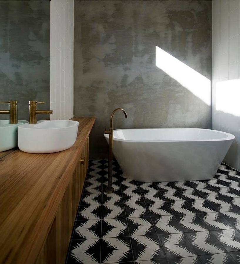 Modern bathroom with large concrete tiles on the floor and walls