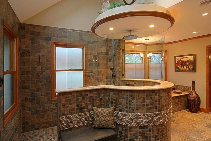 Bathroom stone wall and tile around the tub i'd probably take baths in this tub! Just make the stone wall a waterfall wall