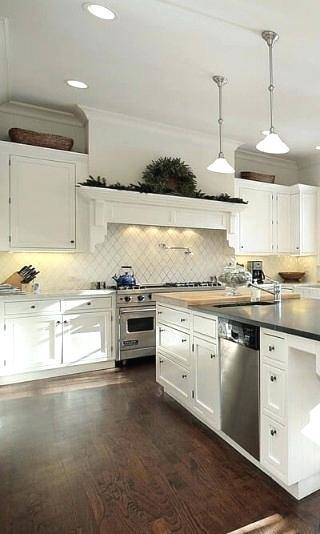 Off white cabinets in casual kitchen by Kitchen Craft Cabinetry · KateFales2