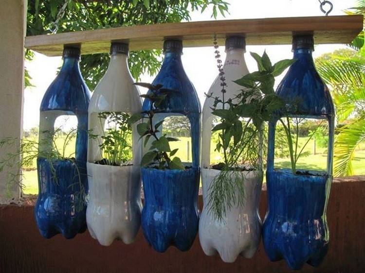 Autumn garden decoration with hanging glass bottles vases