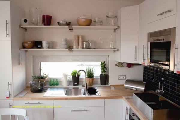 See and interact with this kitchen · A kitchen featuring dark brown wood grain cabinets and a white tile floor