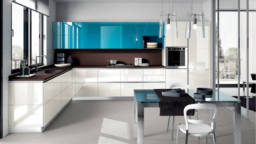 A kitchen cabinet section with open drawers showing glassware, plates and utensils