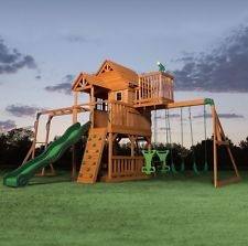 This wooden complete backyard play set comes complete with a slide, swings, climbing wall, and trapeze set to provide children with hours of climbing,