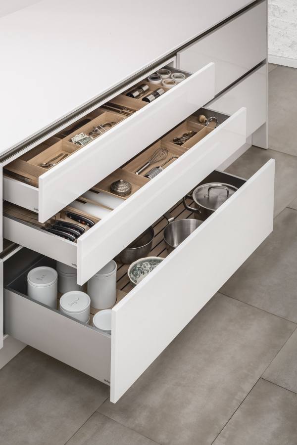 Kitchen drawers efficiently holding dishes, in a photo from IKEA