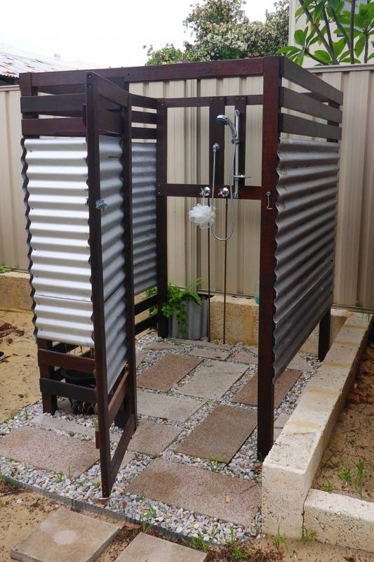 A wonderful tropical outdoor rain shower attached to the master bath