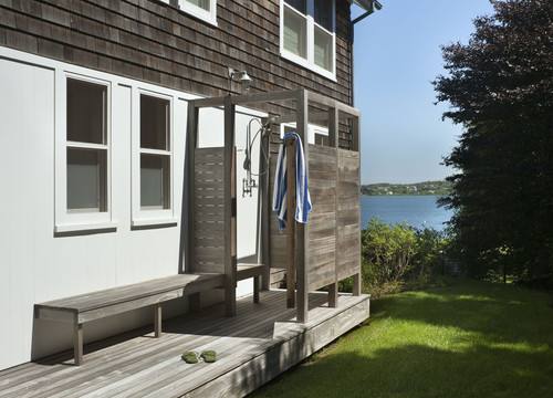 This beach house went with a surf theme for their outdoor shower