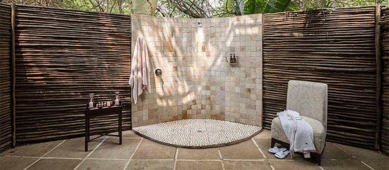 Above: An outdoor shower in a secluded corner of a Cape Cod garden needs no walls, doors, or curtains
