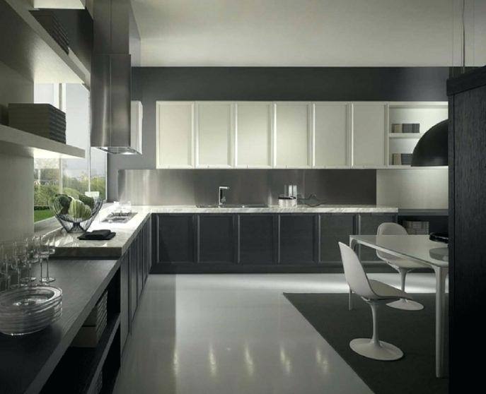 Two tone cabinets, Light plays off the glass tile backsplash and stainless  steel dishwasher and adds a sleek touch to this midcentury modern kitchen