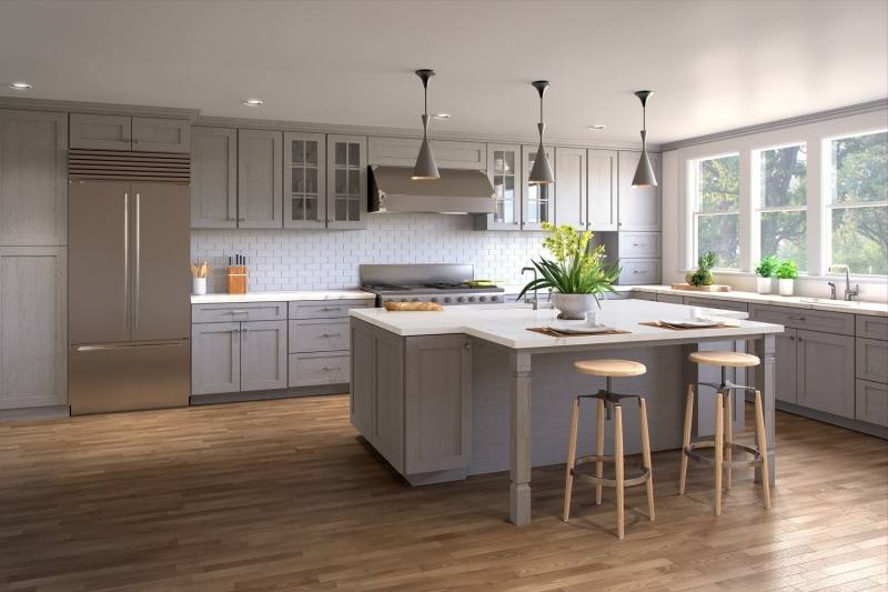 Gray and white kitchen features a white kitchen island topped with a white  marble countertop seating a backless iron bar stool and completed with a  sliding