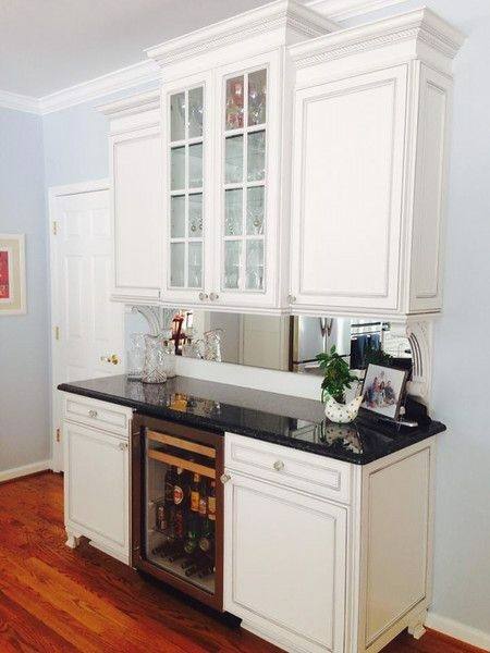 This bright, modern kitchen was designed by Cabinets Direct USA with WOLF Classic Cabinets in Dartmouth White