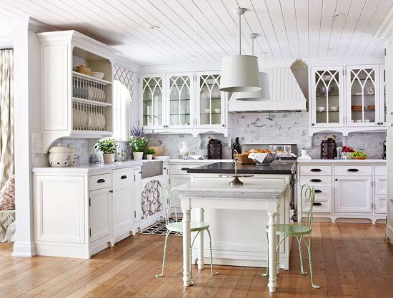 Dark floors,white cabinets, white granite, silver knobs and gray paint wall