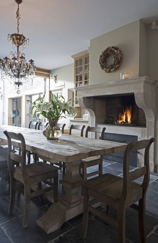 Transitional dining room with tiled floor and chandelier