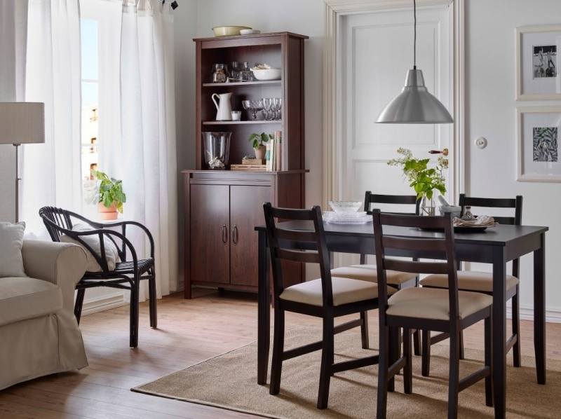 Dining room with dark wood dining table and  grey upholstered dining chairs