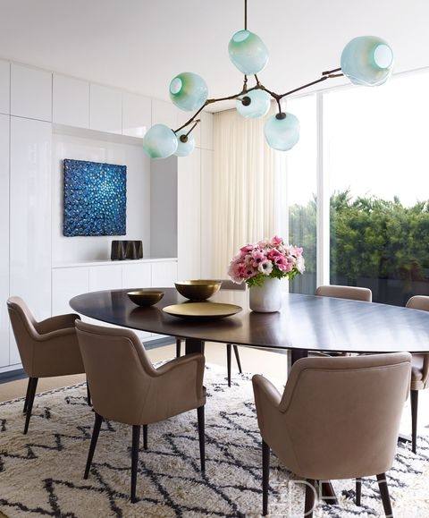 Colorful artwork stands out in this modern dining area