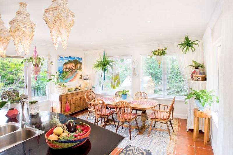 Chic eclectic dining room with lovely grey walls, blue velvet upholstered chairs and a wood oval dining table | An Ornate Nest for Three in Norway