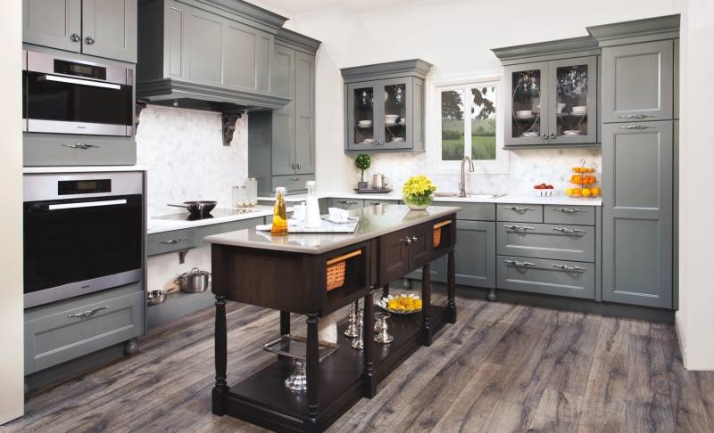 Off white cabinets in casual kitchen by Kitchen Craft Cabinetry