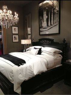 Inspiration for a classic bedroom in London with white walls and dark  hardwood flooring