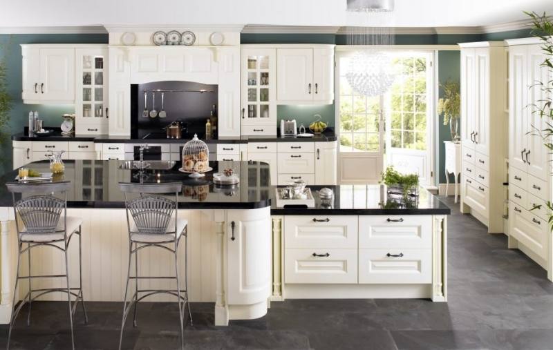 Puritan Off white cabinets in maple magnolia with a blue kitchen island  blue lagoon