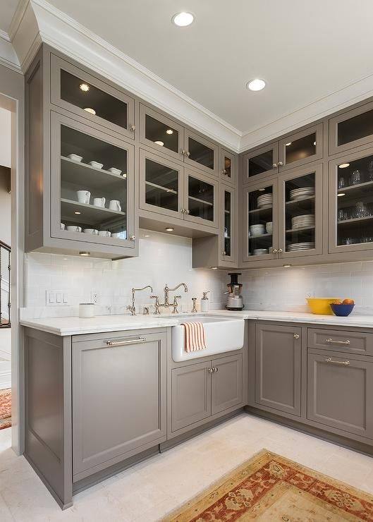 Choosing  the right wall paint color with dark wood cabinets can make a big  difference in