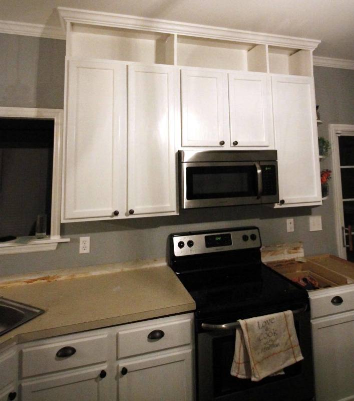 moving cabinets up to the ceiling ***i like the open shelving underneath