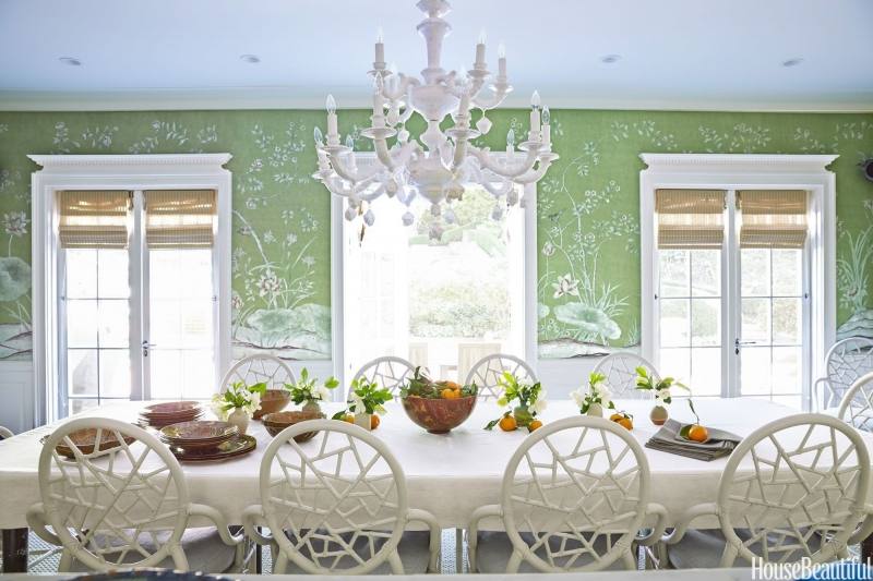 Green walls provide a beautiful backdrop for the eclectic dining room [ Design: LDa Architecture