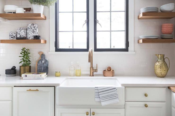 kitchen cabinets with windows behind crisp white cabinetry in this kitchen  brightens up the wood and