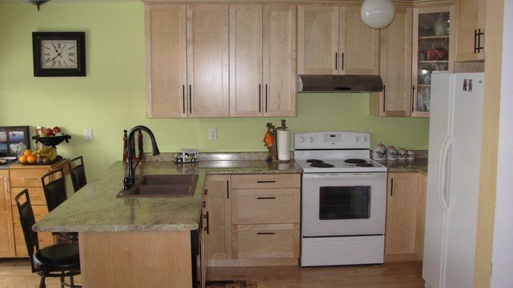 Warm Maple wood cabinets with a white kitchen island