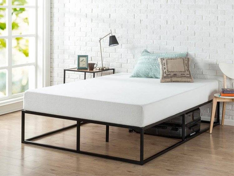 The zinus upholstered bed frame in dark grey, assembled in a bedroom