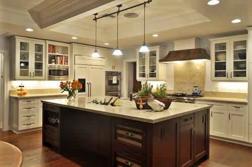 Traditional kitchen with white cabinets and a gray kitchen island
