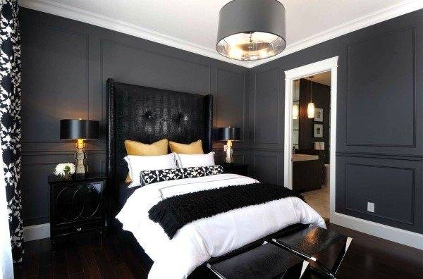 Pair a bold black headboard and black decor with white walls to add lightness to your black bedroom
