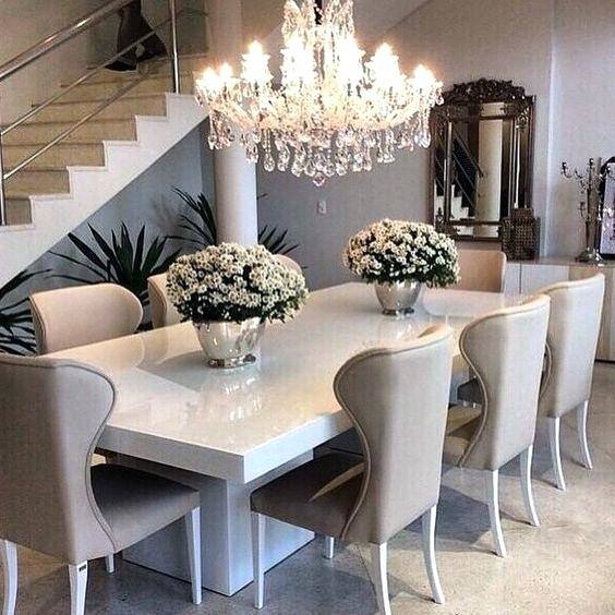 Stylish chairs and a gorgeous gray backdrop shape the contemporary dining room [Design: ONEinteriors