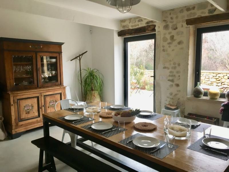 This smaller dining area still packs in style with its classic hanging  lamps and giant 'EAT' sign, letting everyone know where to come to dine